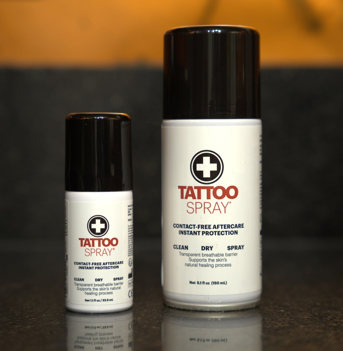 The 32.5 ml take-home can beside the 150 ml professional can, shown to scale